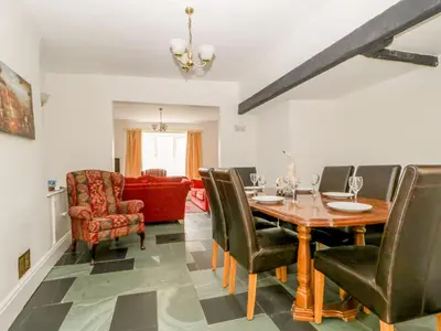 a dining room with a table and chairs at Fountain Cottage in Keswick
