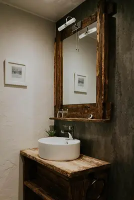 a bathroom with a sink and a mirror at Troutbeck Inn in Troutbeck