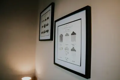 two framed pictures hanging on a wall at Troutbeck Inn in Troutbeck