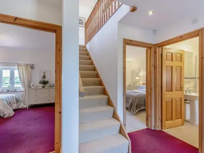 a staircase in a home with a bedroom at New Park Farm - Church Cottage in Ireby