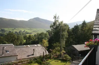 a view from the balcony of a house with mountains in the background at StoneyGill in Keswick