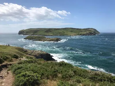 a view of the ocean from a hill with a bluff at IntentsGP @ Isle of Man TT, IOMTT in Douglas