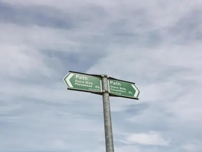 a street sign with two green signs on a pole at The Bothy in Mainsriddle