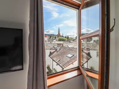 a window with a view of a city at Sky View in Keswick