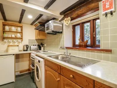 a kitchen with a sink and a dishwasher at The Old Barn in Nether Wasdale