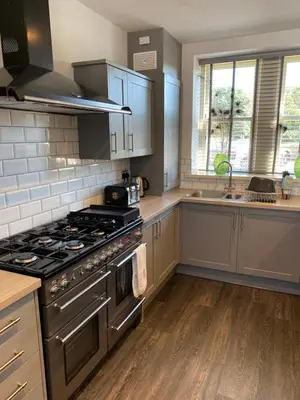 a kitchen with a stove and a sink in it at Irton Hall in Eskdale