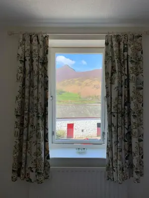 a window with a view of a mountain at Littletown Farm Guest House in Keswick