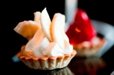 a cupcake with ice cream and bananas in it at Lochside House Hotel & Spa in New Cumnock