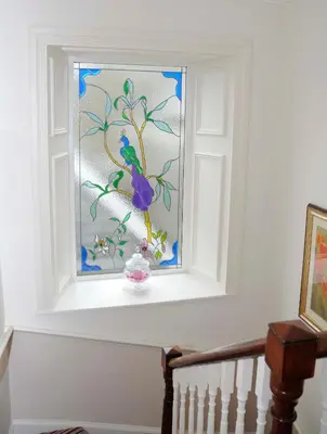 a window in a stair case with a painting on it at Douglas House in Castle Douglas