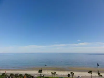a view of the beach and ocean from a building at Edelweiss Guest House in Douglas