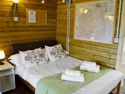 a bed with two pillows on it in a room at Kestrel Cabin - Uk1246 in Westward
