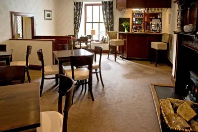 a dining room with a table and chairs at New Dungeon Ghyll Hotel in Great Langdale