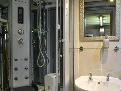 a bathroom with a sink and a shower at Harrison's Lodge - Uk1259 in Threlkeld