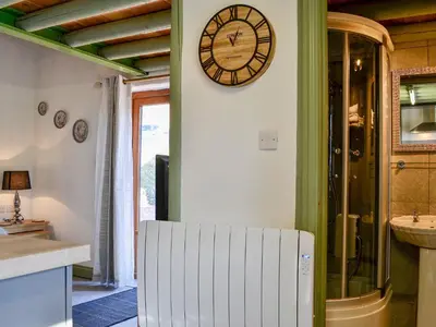 a clock on the wall of a kitchen with a sink at Lucy's Lodge - Uk1260 in Threlkeld