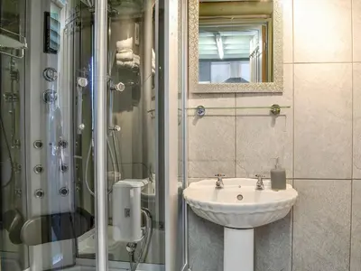 a bathroom with a sink and a shower at Lucy's Lodge - Uk1260 in Threlkeld