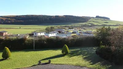 a view of a small town in a field at Cressfield Country House Hotel in Ecclefechan