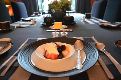 a table with a bowl of food on a plate at Scaurbridge House in Thornhill