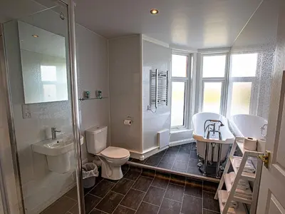 a bathroom with a toilet and a sink and a shower at Sure Hotel by Best Western Lockerbie in Lockerbie