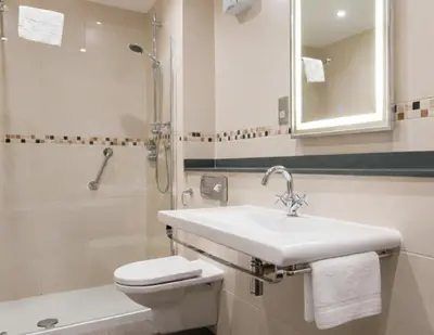 a bathroom with a sink and a toilet and a shower at Lyzzick in Keswick