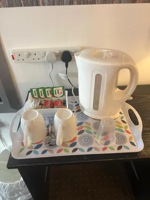 a tea kettle on a tray on a table at The Thistle in Stranraer