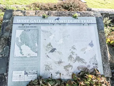 a sign for the west caledonian wildlife trail at The Clamshell in Isle of Whithorn