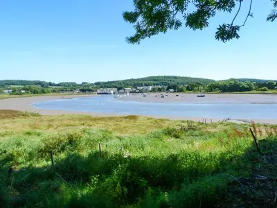a view of a beach with people in the water at 27-29 St Marys Place in Kirkcudbright