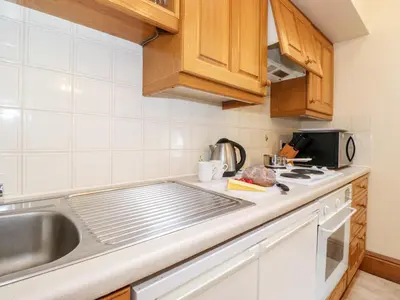 a kitchen with a sink and a counter top at The Hayloft in Keswick