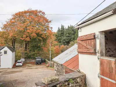 a view of a house with a parking lot at The Byre in Cockermouth
