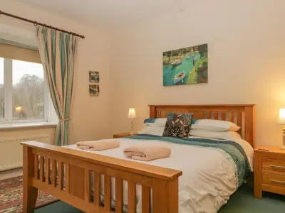 a bedroom with a bed with two pillows on it at The Old Vicarage in Thirlmere