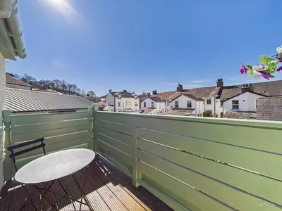 a balcony with a chair and a view of the city at Aura in Keswick