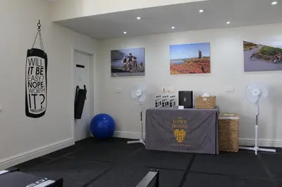 a room with a table and pictures on the wall at The Town House in Douglas