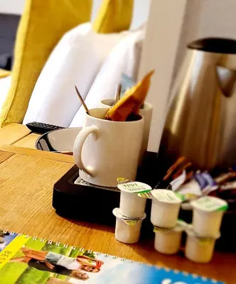 a cup with some food in it on a table at The Market Inn Hotel in Castle Douglas