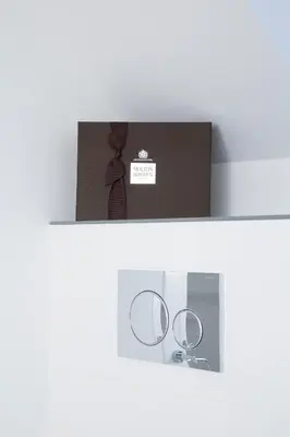 a shelf with a pair of glasses and a box at The Annex in Carlisle