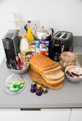 a counter with a loaf of bread and other food at The Annex in Carlisle