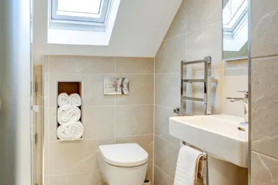 a bathroom with a toilet and a sink at The Grand at Grasmere in Grasmere