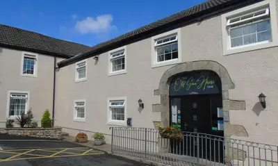 a building with a sign on the front of it at The Old Ginn House Inn in Great Clifton