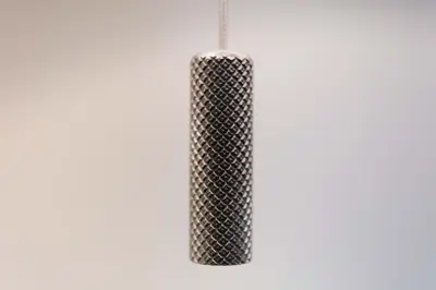 a black mesh vase on a white background at Ailsa Retreat in Troon