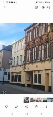 two photographs of a building on a city street at The Queensberry Hotel in Dumfries