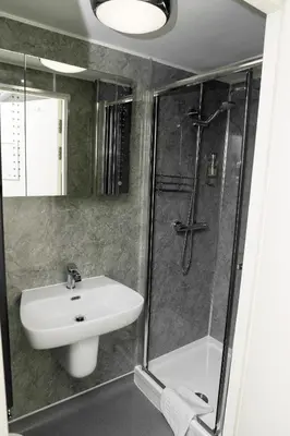 a bathroom with a sink and a shower at Black Bull Inn, Moffat in Moffat