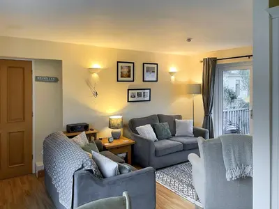 a living room with two couches and a couch at Briargarth in Keswick