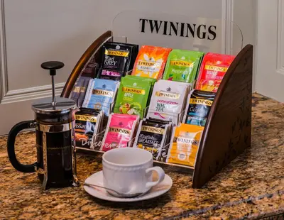 a counter top with a tray of food and a cup of coffee at The Devonian in Douglas
