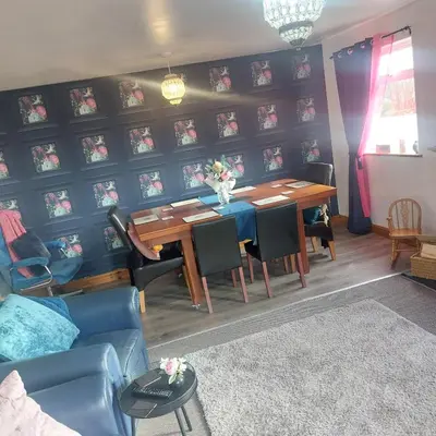 a dining room with a table and chairs at Broadlea of Robgill Country Cottage bed and breakfast in Ecclefechan