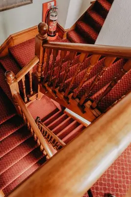 an overhead view of a staircase with red seats at Goodwin House in Keswick