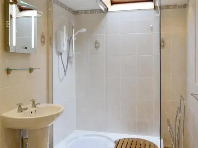 a bathroom with a shower with a sink and a shower at Low Cordorcan - Uk5891 in Bargrennan