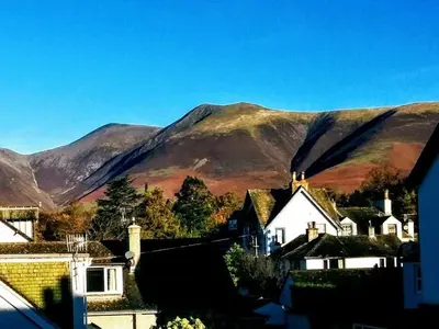 a view of a village with mountains in the background at Salisbury Guest House in Keswick
