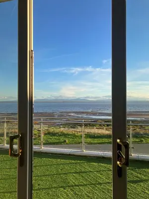 a view of the ocean from a window at The Powfoot Hotel, Annan in Annan