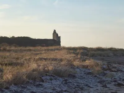 a building on top of a hill in a field at Abbots Way in Ayr