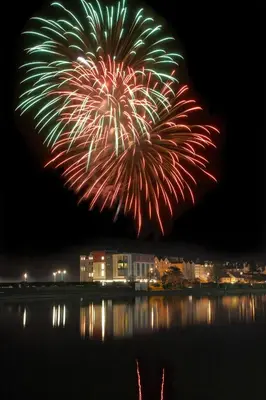 a firework display over the water at night at Ramsey Park Hotel in Ramsey