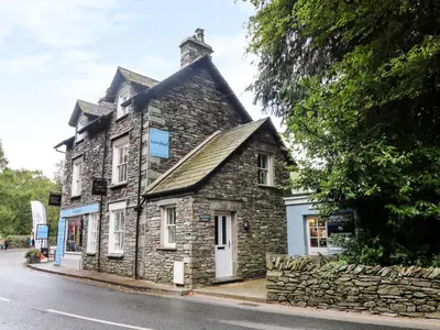 an old stone building on the side of a street at Shepherd's Crook in Ambleside