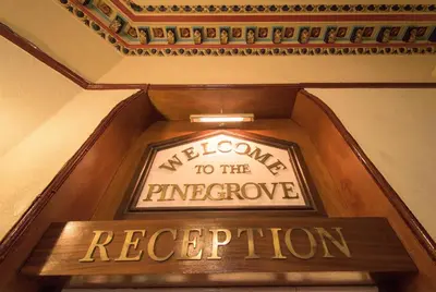 a welcome to the emergency reception sign on an elevator at Pinegrove Hotel in Carlisle
